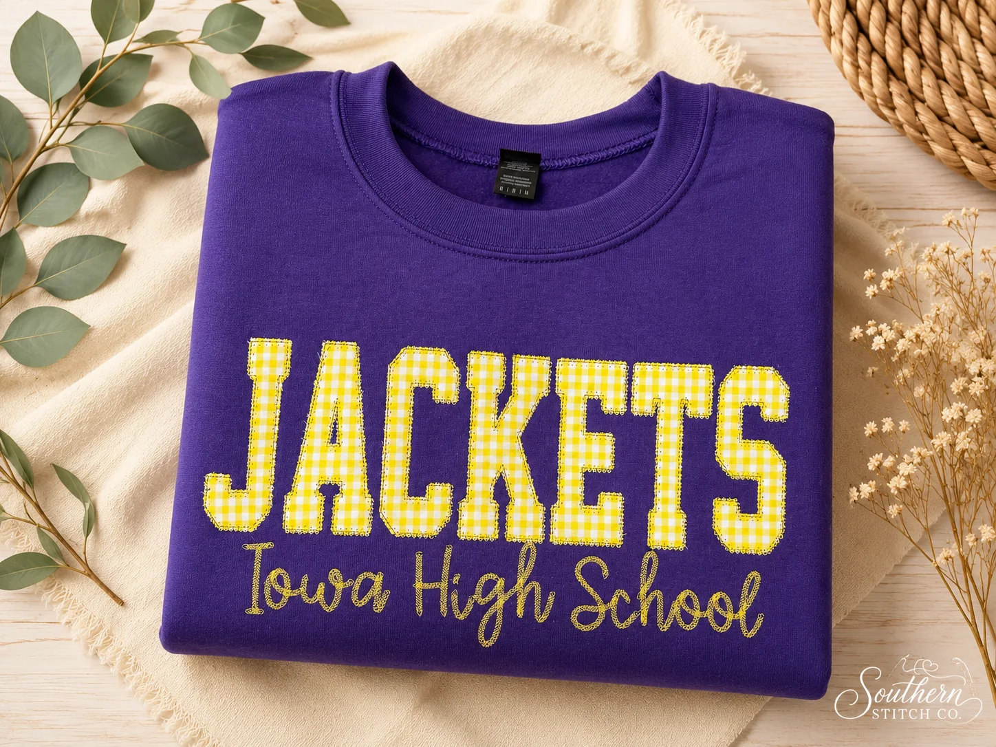 Purple embroidered Jackets sweatshirt.