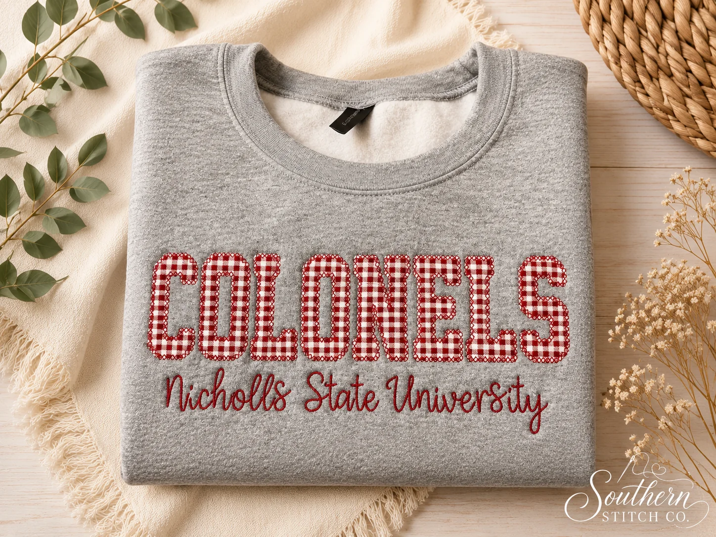 Gray Colonels sweatshirt with red gingham appliqué.